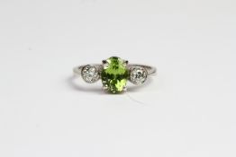 18ct Peridot and diamond 3 stone ring. No weights known Ring size O