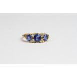 18ct Carved half hoop ring with 3 sapphires and 4 small diamonds. Hallmark present. Ring size M