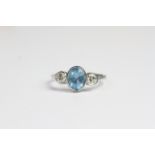 Platinum bezel set aquamarine and diamond 3 stone ring. A1.10 ct D 0.40 cts in total Ring Size N