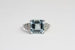 Platinum square step cut Aquamarine and diamond set step Deco style ring. Each side of the