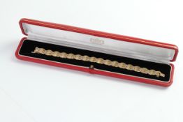 Cartier Gold Bracelet with Diamonds, three tier integrated link with brilliant cut diamond across (