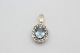 9ct gold aquamarine & diamond halo set pendant (1.3g)