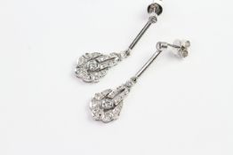 18ct long drop diamond earrings with circular backs. No weights known.