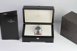 A FINE PATEK PHILIPPE CALATRAVA PILOT TRAVEL TIME REFERENCE 5224G-001, SEALED FROM SERVICE, WITH BOX