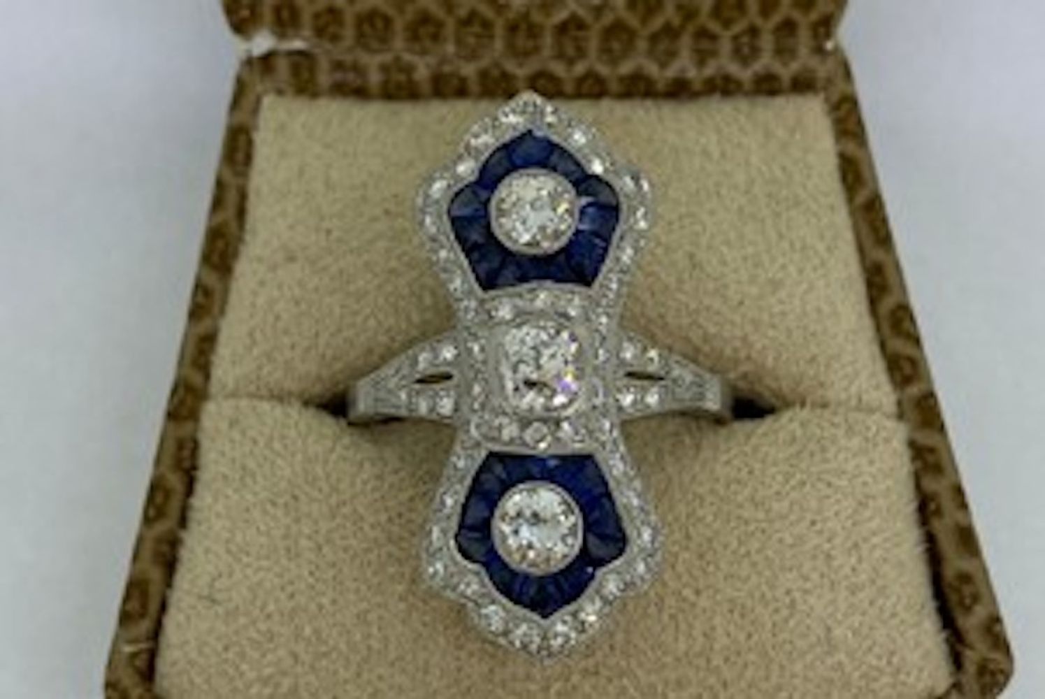 Platinum up the finger sapphire and diamond ring with calibre set sapphires in each fan 3 RB bezel s