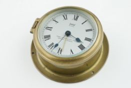 SESTREL BULKHEAD ALARM CLOCK BY HENRY BROWNE, circular dial with roman numeral hour markers and