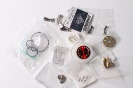 A collection of watch parts including Rolex, glasses, end links,date wheels, serile diamond dot