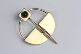 Cabochon cut green stone brooch