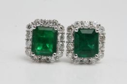 18 white gold Emerald and diamond rectangular cluster earrings. E2.54 cts D0.77 cts