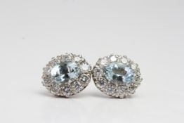 18 white gold Claw set oval aqua and diamond cluster earrings A2.50 D1.90