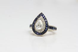 14 carat gold sapphire and diamond pear shaped ring with central pear being 1ct.