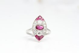 White metal Navette shaped ruby and diamond ring with central oval ruby and two diamonds, with a