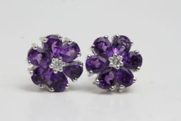 18 carat white gold Amethyst cluster earrings with diamond centre