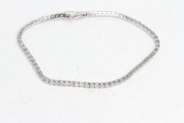 18 carat white gold claw set diamond line bracelet Total diamond weight 2.95ct 70 diamonds, 2 x ‘