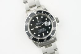 ROLEX OYSTER PERPETUAL DATE SUBMARINER REF. 16610, circular black dial with hour markers and