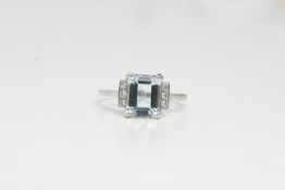 Platinum aqua and diamond ring. A Step cut aquawith 3 diamonds in each shoulder panel.A2cts D0.