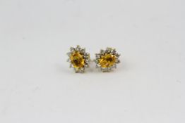 18YG yellow sapphire and diamond cluster earrings. Hallmarked 18ct