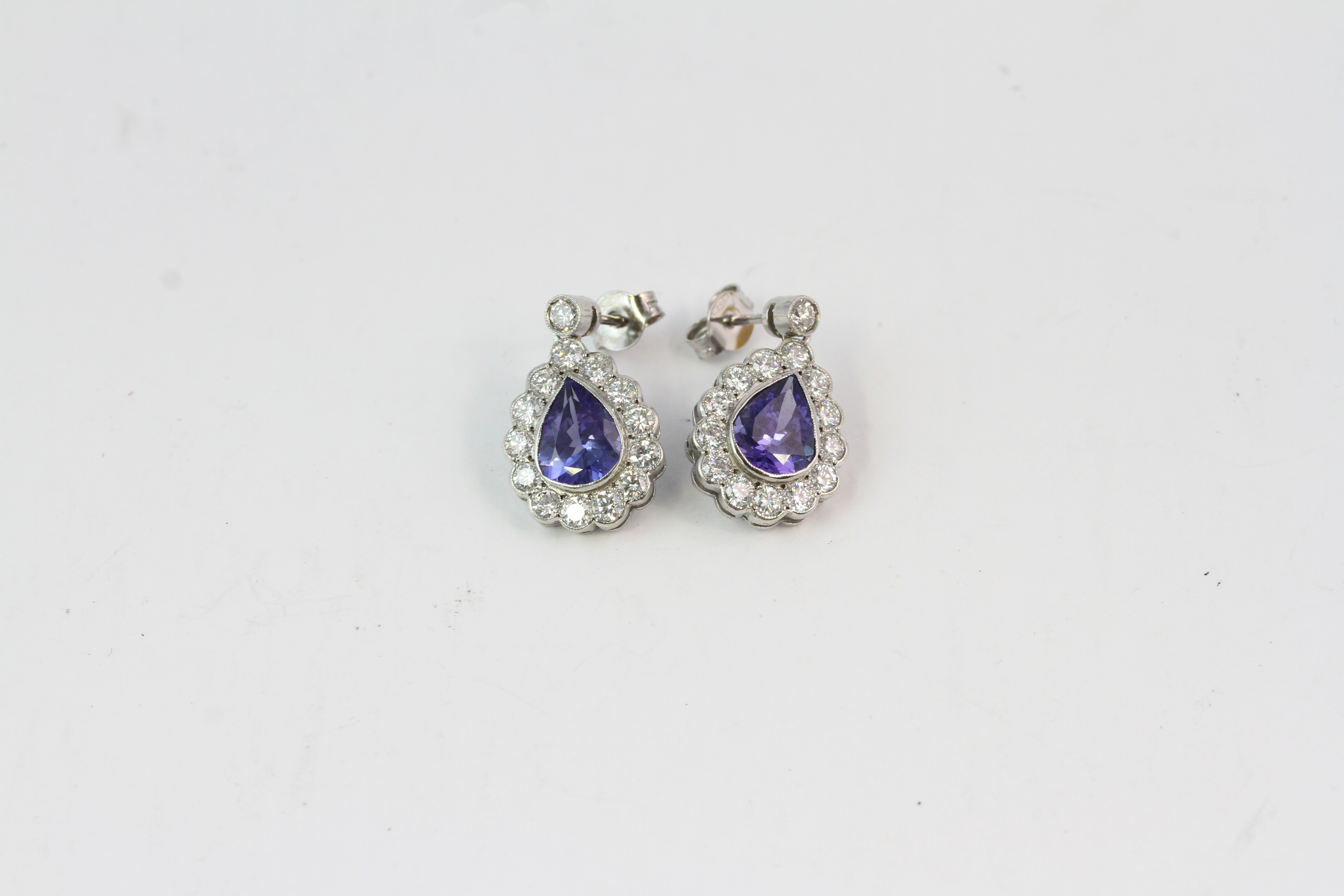 18WG Tanzanite and diamond cluster drop earrings, pear shaped. TZ 3.10 D1.60