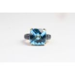 Topaz with sapphire shoulders ring