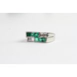 Art Deco Diamond and Emerald Ring, square cut stones, cross over abstract design, mounted in white