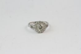 18WG flower shaped diamond cluster ring with split diamond shoulders Central diamond 1ct with 0.