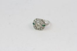 18WG deco style tablet ring. Bezel set central diamond with 2 emerald baguettes. Est 1ct (1.01)