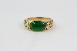 Jade and gold ring.