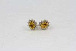 18YG yellow sapphire and diamond cluster earrings. Hallmarked 18ct