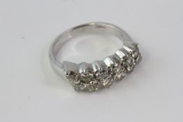 Diamond bar ring comprising 12 round brilliant diamonds in two rows of six.