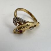 Fine high carat and old cut diamond, ruby snake ring. Set with old cut diamonds and a ruby in the