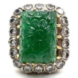 Fine platinum carved emerald and diamond ring with 18ct gold detailing. Set with a large emerald