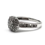 Fine 18ct white gold diamond cluster ring . Set in white gold with brilliant cut diamonds - the head