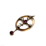 Antique 9ct gold ruby and seedpearl pendant. Itâ€™s marked 9ct gold set with rubies and