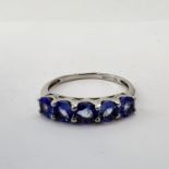 Fine 9ct white gold and tanzanite five stone ring. Fully hallmarked for 9ct gold. Uk size N 1/2 .