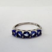 Fine 9ct white gold and tanzanite five stone ring. Fully hallmarked for 9ct gold. Uk size N 1/2 .