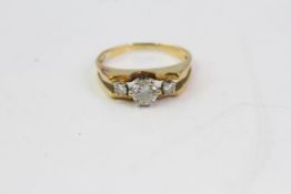 find 18 CT gold 50 point three stone diamond ring. Set in an 18 Karat yellow gold shank with a