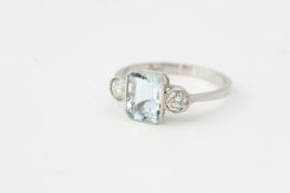 Platinum aquamarine and diamond ring in a rub over setting. No weights known.