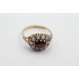 9ct gold opal and garnet dress ring weighs 2.5 grams. Fully hallmarked for 9ct gold. Uk size. N