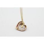 9ct gold ruby & diamond heart pendant on chain - weighs 1.6 grams. Marked 375 for 9ct gold and DIA .