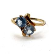 Fine 10ct gold and blue topaz twist ring. Marked 10k . Measures uk size p 1/2 . Total weight 1.7