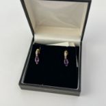 fine 9CT gold amethyst and diamond earrings. They are marked 9K. Set with amethyst and diamonds.