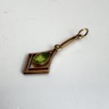 Antique 9ct gold peridot and seedpearl pendant . Marked 9ct gold. Measures 3.2cm x 1.2cm wide.
