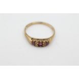 9ct gold ruby three stone ring weighs 1.8 grams . Hallmarked for 9ct gold. Uk size O