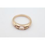 9ct gold ruby sided morganite band ring , weighs 2.7 grams . Marked 9k. Set with a pink morganite in