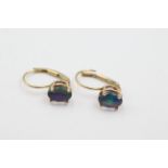 14ct gold opal earrings weighs 1.3 grams. Marked 14k . Measures 1.5cm in length