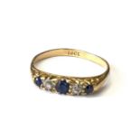 Antique 18 CT gold sapphire and diamond ring. Marked 18 CT. Set with alternating sapphires and old