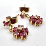 Fine 9ct gold ruby and diamond dangly floral earrings . Fully hallmarked for 9ct gold. Measures 1.