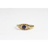 Antique 18 CT gold sapphire and old cut diamond ring. Set with a sapphire in the centre and