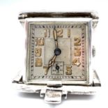 Art Deco silver travelling watch. Itâ€™s in working order with illuminated numerals and cathedral
