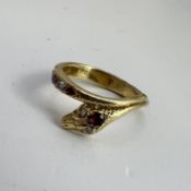 Fine high carat gold alternating almandine garnets and rose cut diamond snake ring. Set in gold with
